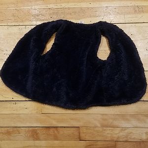 This is a navy blue fleece vest